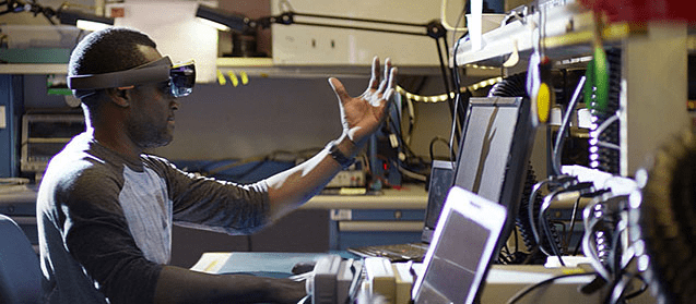 A person looking at his hand through virtual reality glasses