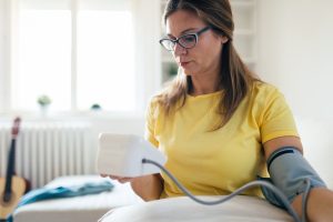 Woman checking her blood pressure