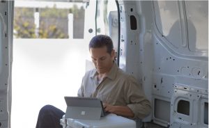 Person remotely monitoring the temperature of a motor that’s whirring away in customer’s building