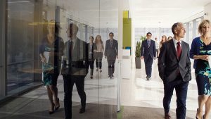 Business professionals walking into an office