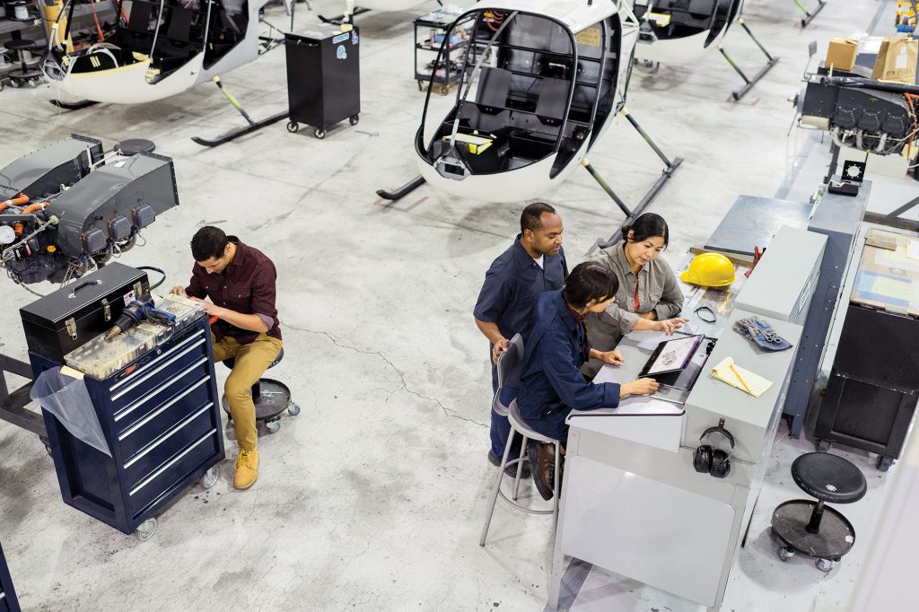 Employees working in a helicopter factory