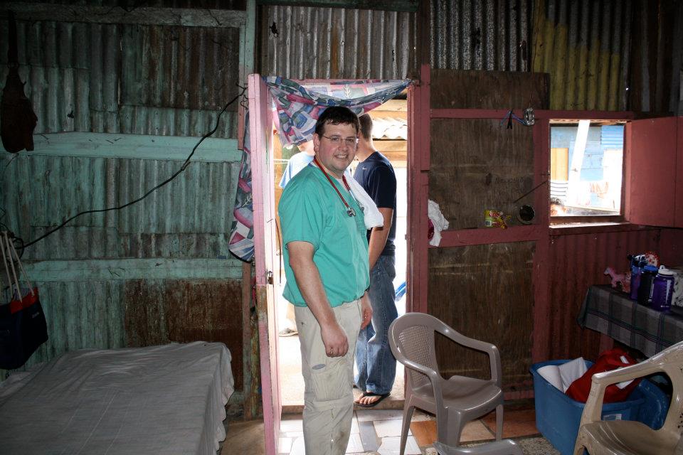 Greg Moore preparing for a Honduran village volunteer medical clinic in the home of a family who generously offered it for use for the day.