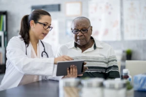 Doctor and patient With A Tablet Computer