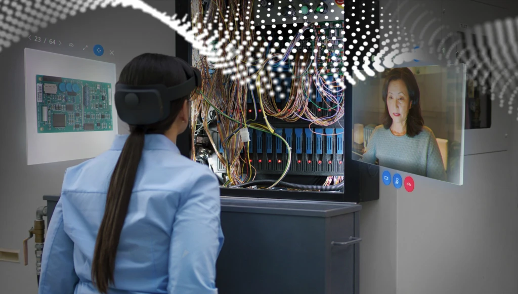 person wearing an AR headset looking at a computer system