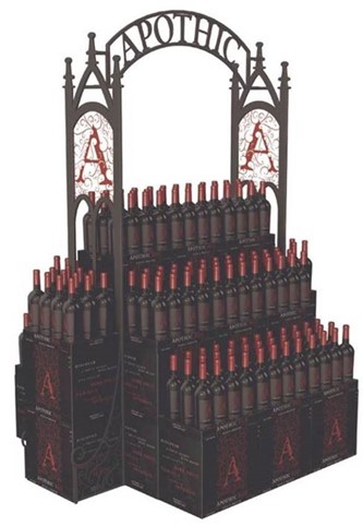 Display of wine bottles stacked on a riser that has the branding for Apothic wine