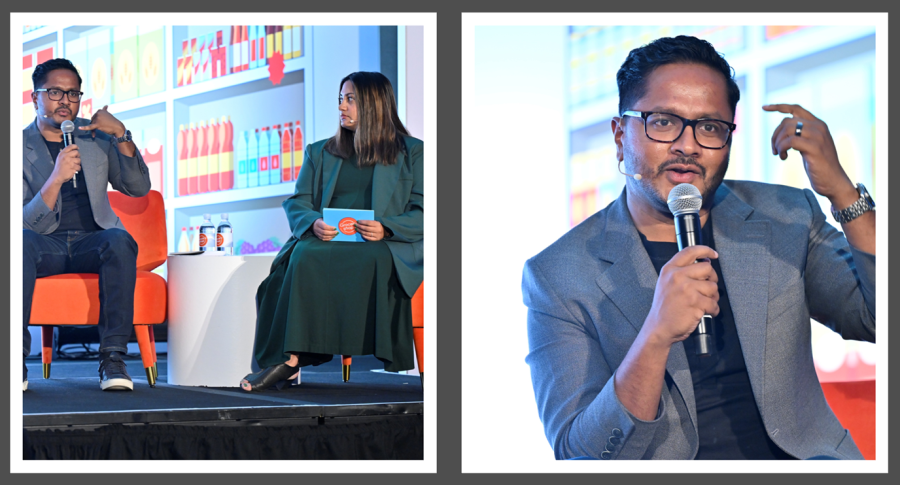 Satish Thomas sitting in a chair speaking. 