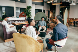 Entrepreneurs at work in a common area of a creative workplace.