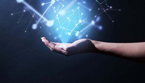 A hand open upwards over which lights hover