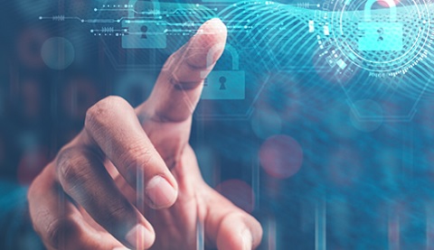 Eine Hand zeigt auf ein Hologramm.