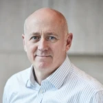 Chris Ensor, a man smiling for the camera