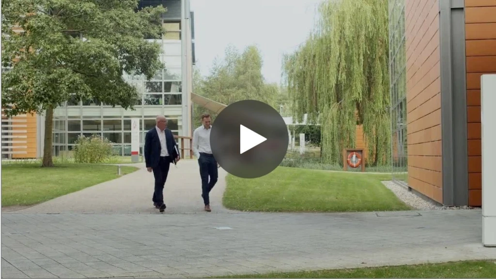 Two business men walking outside Vodfone headquarters