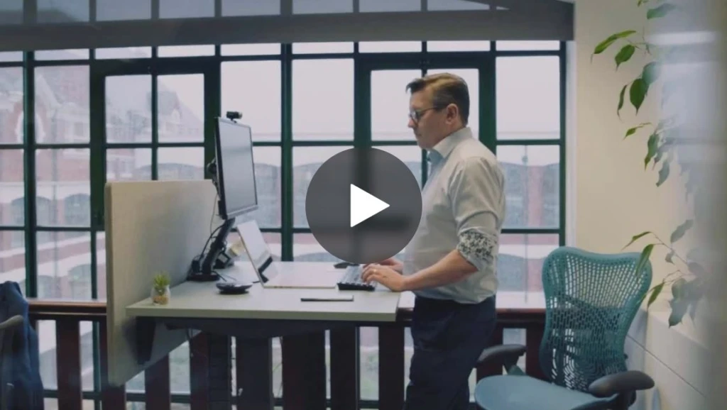 A person standing in front of a computer