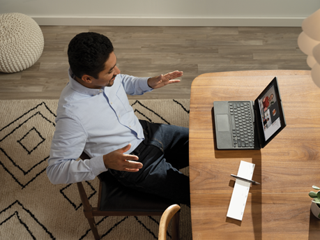 The future of work includes accessibility: A man sitting at a desk on a Teams meeting