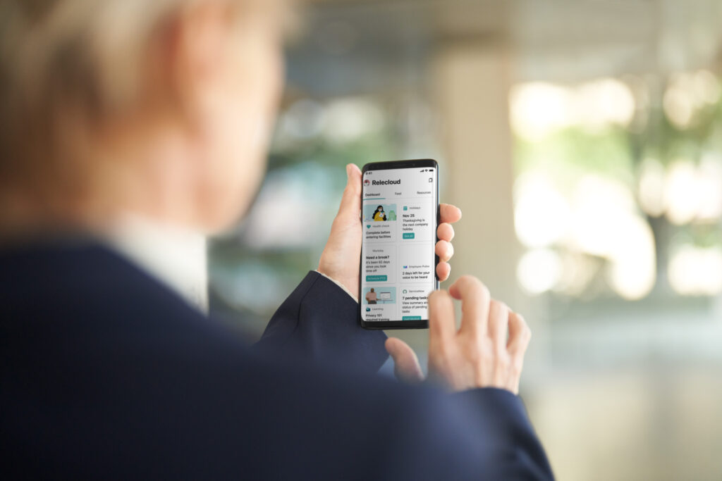 Worker reviewing her Viva dashboard on a mobile device