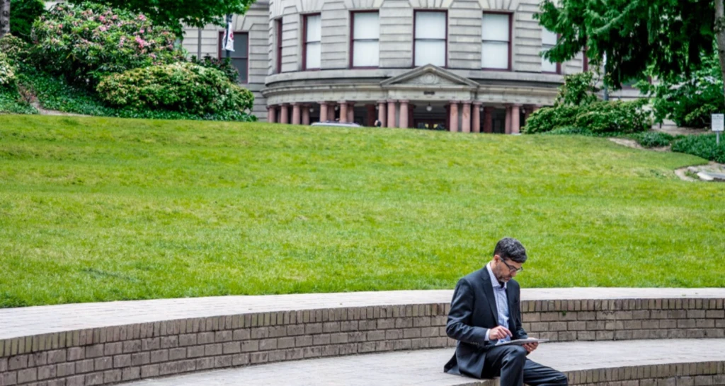 man infront of building