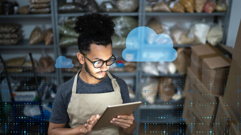 man looking at his tablet
