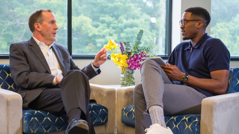 a couple of people that are sitting on a table