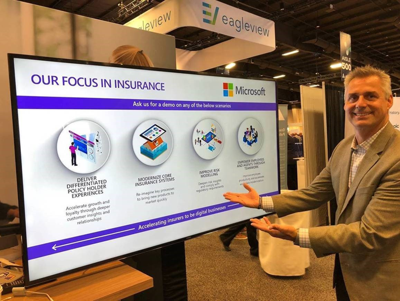 A man showcasing a monitor display