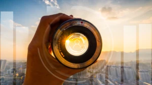 hand holding up a telescope