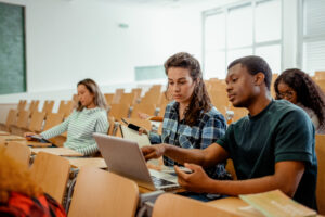 A group of people sitting in a lecture hall