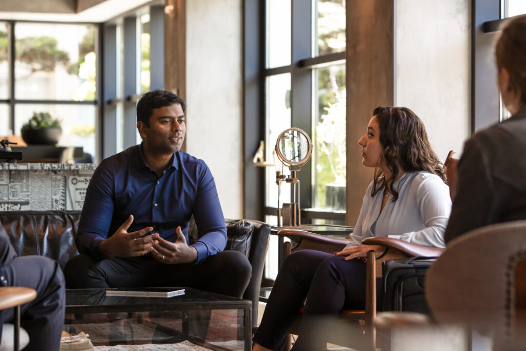 Two colleagues having a meeting in open room