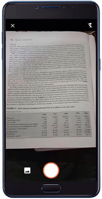 Animated image of data being brought into Excel from a picture taken by a phone.