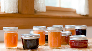 Photo of unlabeled jam jars on a kitchen counter
