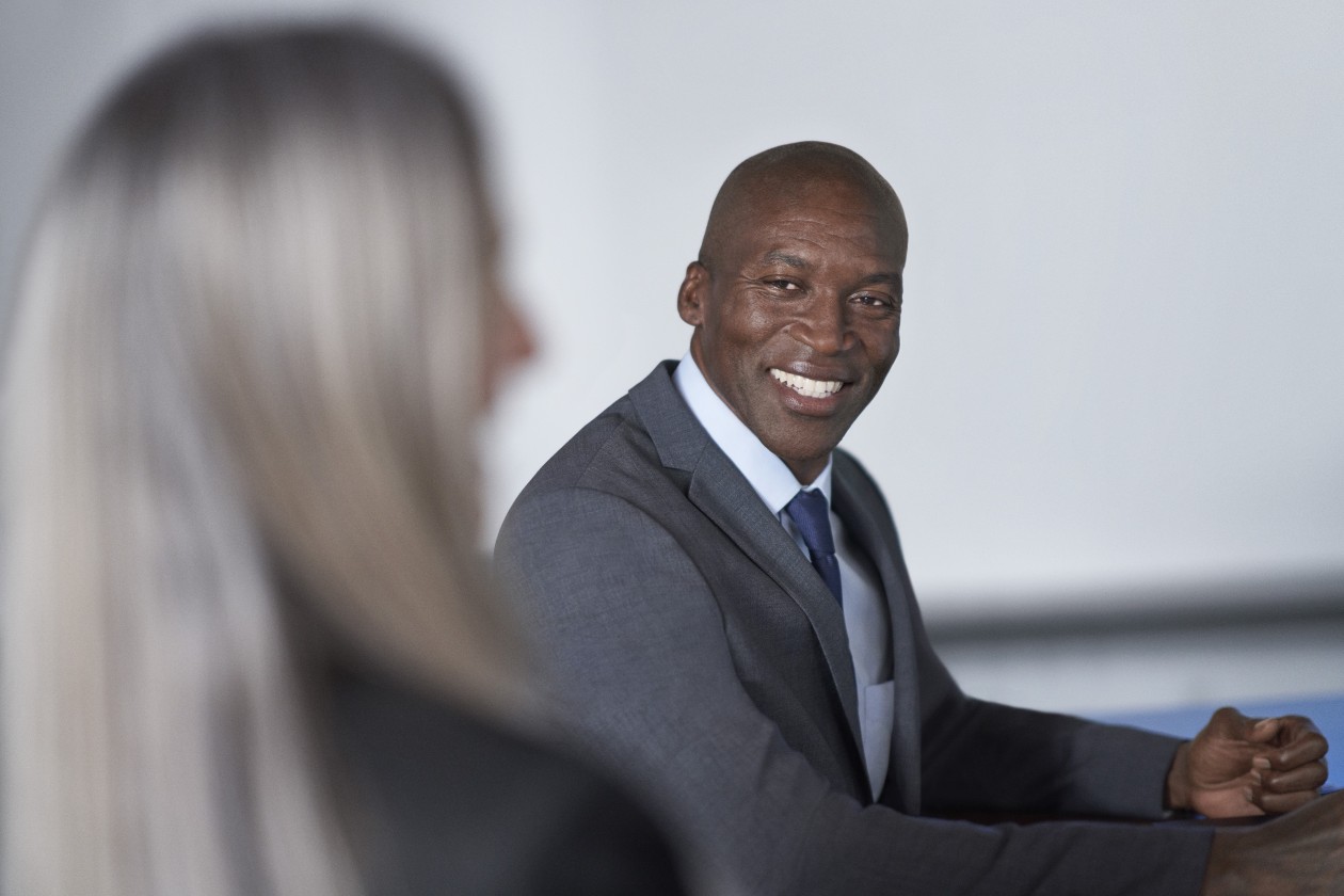 CISO (chief information security officer) presents to the board of executives on security topics. Note: Photo files with "alphaChannel" included in the file name include the image with and without a (transparent) background&mdash;people are already clipped from the background for you, production ready, to assist with your project needs.