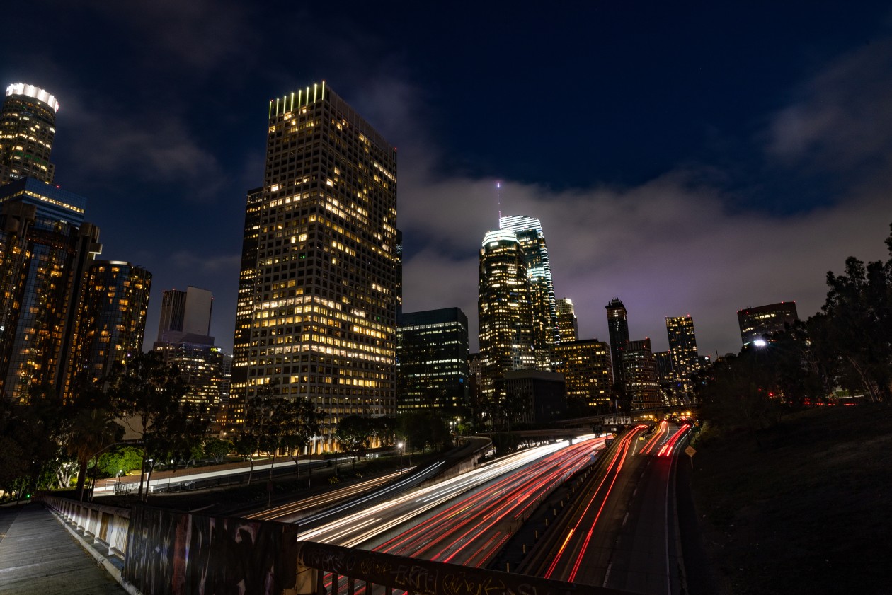 Time-lapse of nighttime traffic around a city core.