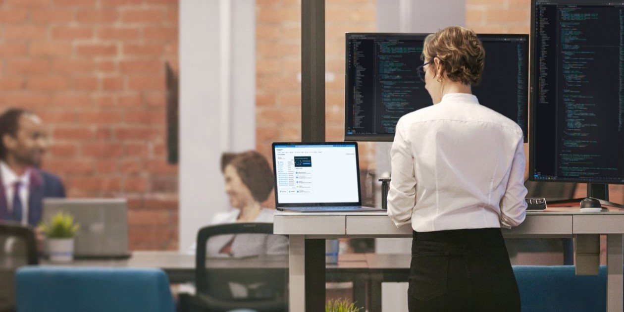 A woman looking at a computer screen