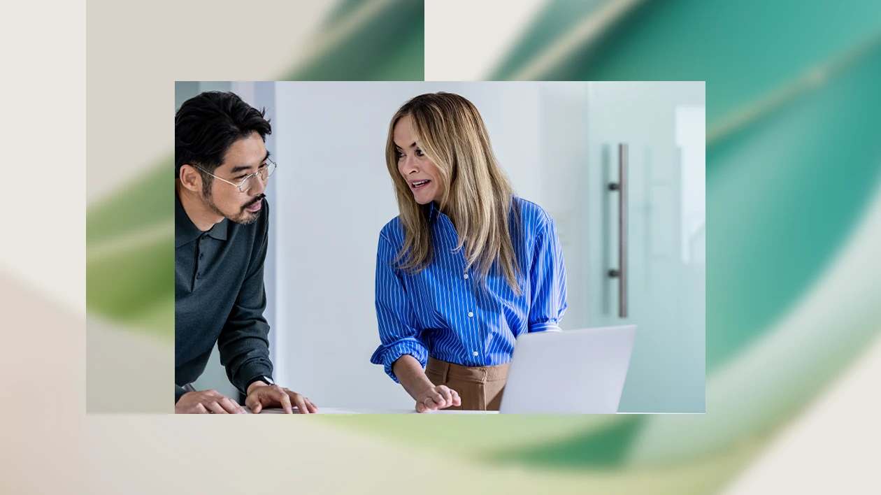 Electric car engineers collaborating in factory office.