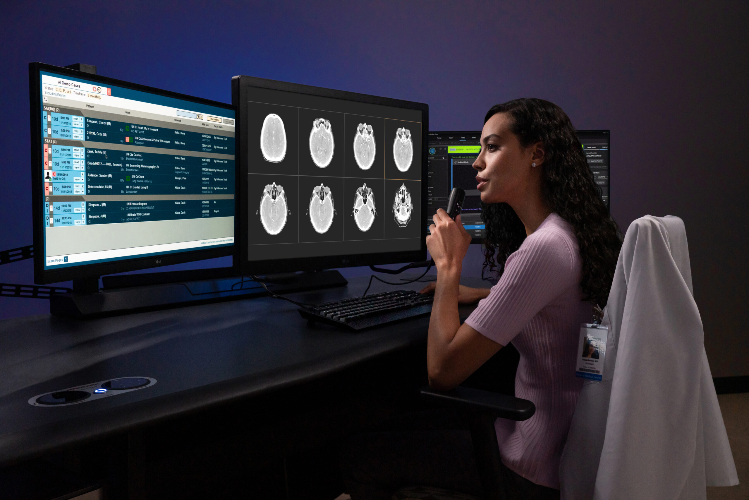 Female radiologist dictating report into PowerMic at a workstation