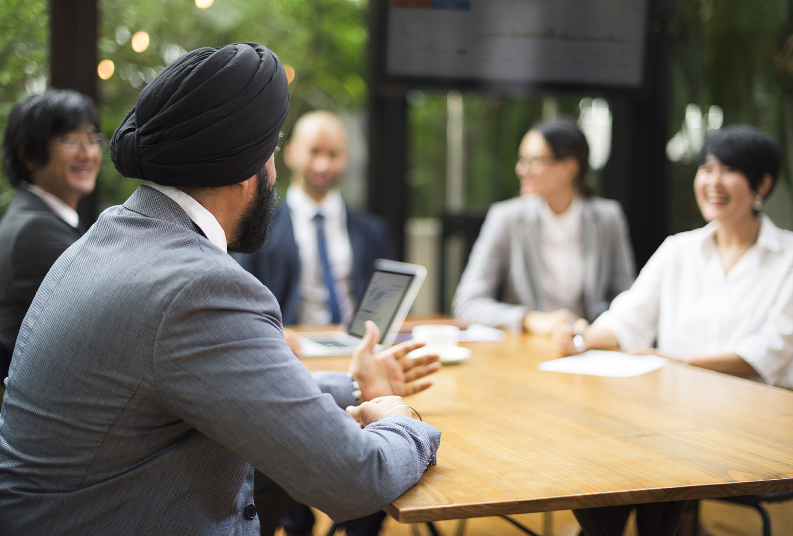 people sitting around the table in office environment