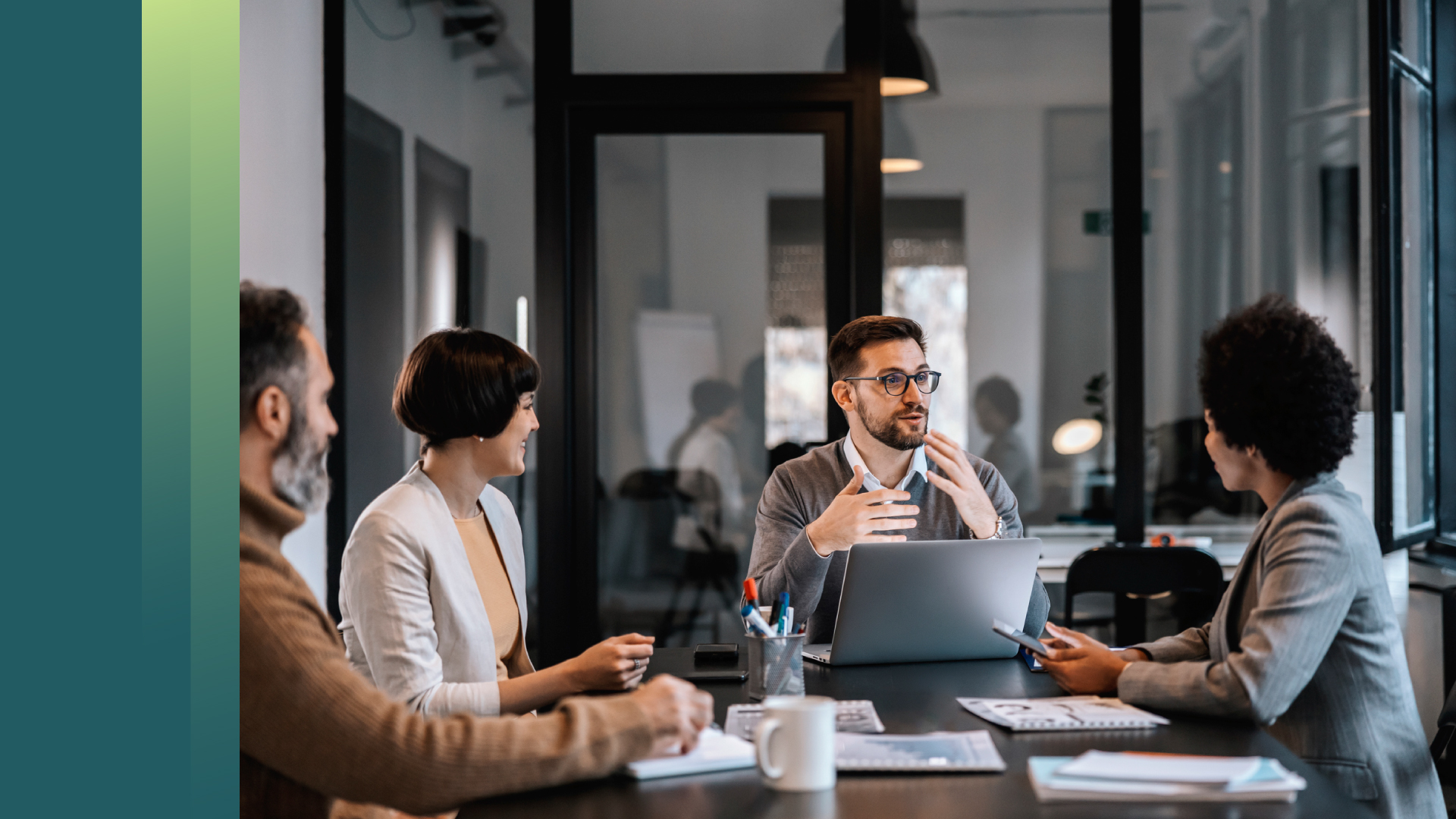Four working professionals in a meeting room