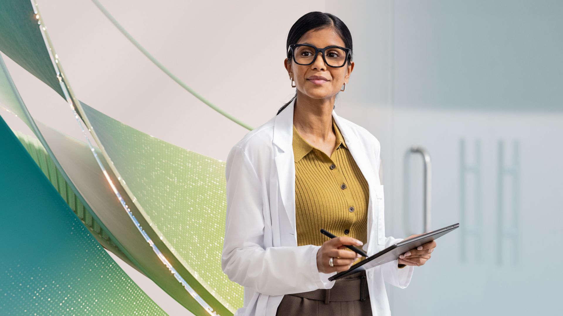 Doctor working on a tablet with an abstract background