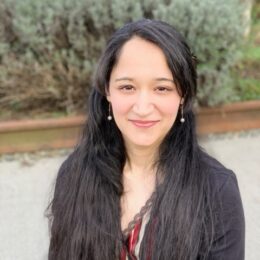 A woman smiling at the camera