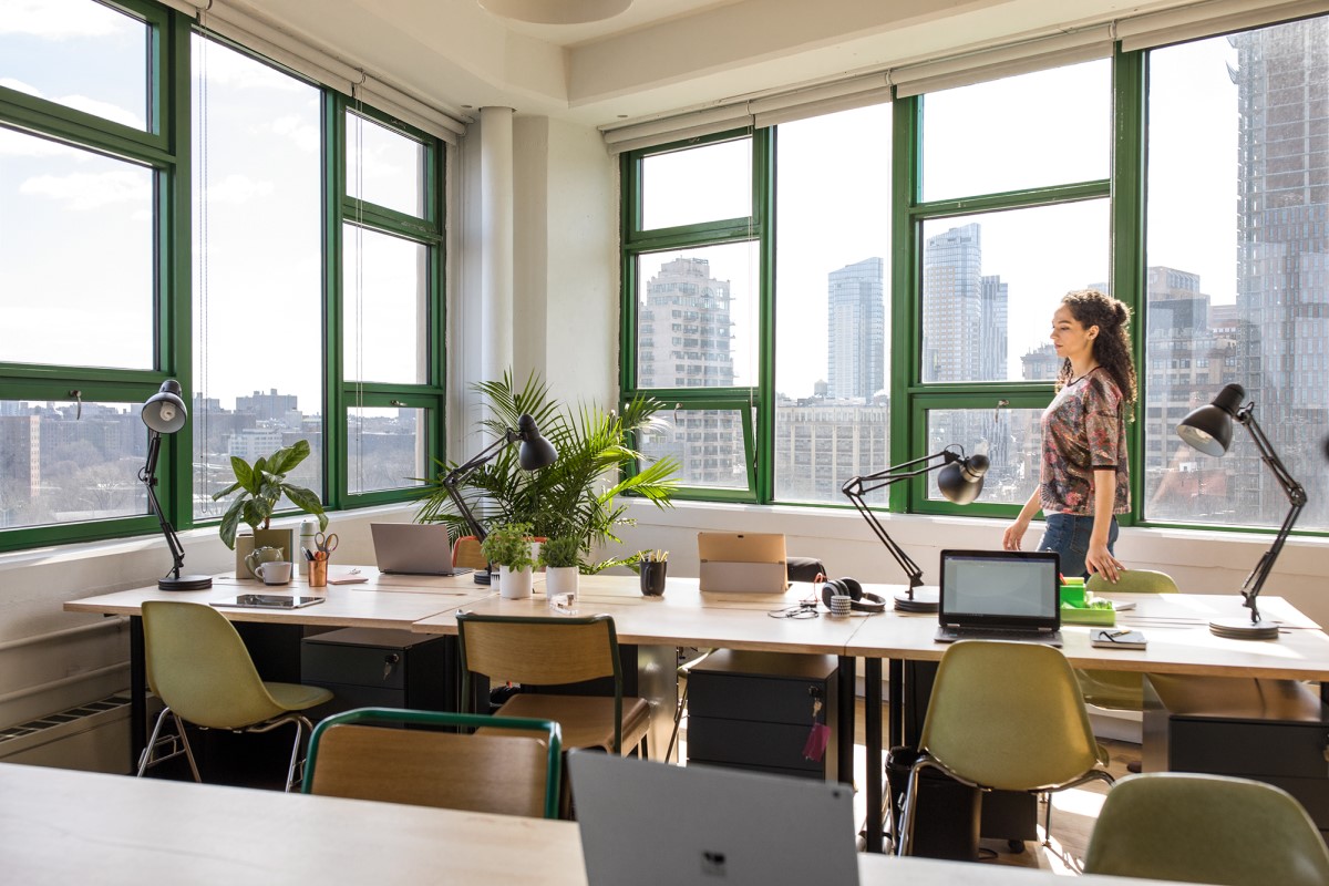 Young, small business female in modern workplace.