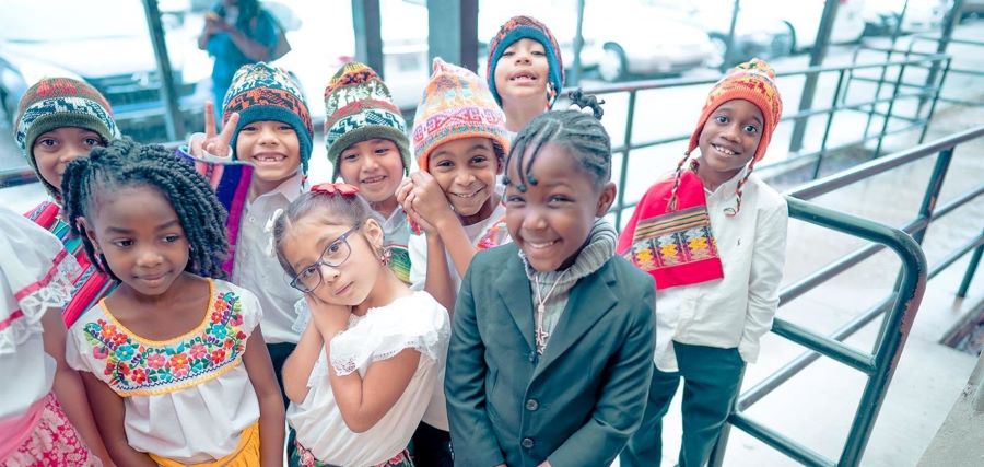 A group of young children smiling.