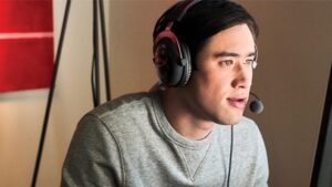 Cineplex thumbnail - A man wearing headphones and talking into a microphone