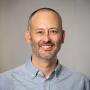 A man smiling for a picture