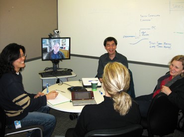 The Embodied Social Proxies team enjoys a business meeting that includes