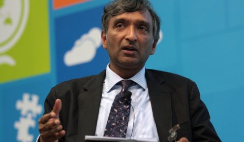 Anoop Gupta wearing a suit and tie