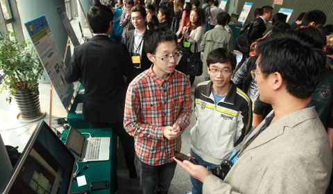 a group of people standing in front of a crowd