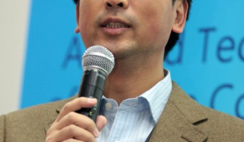 Ko Wing-man wearing a suit and tie