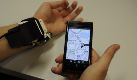 a hand holding a cell phone