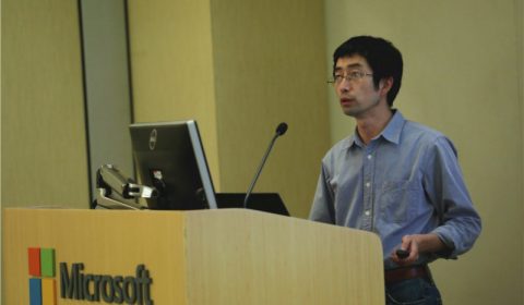 a man standing in front of a box