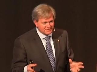 Brian Schmidt wearing a suit and tie