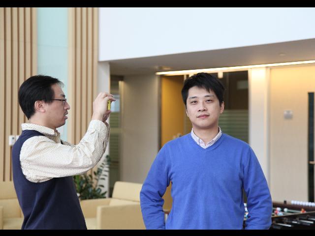 a couple of people that are standing in a room