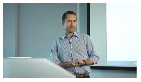 Mike Ananny sitting in front of a laptop