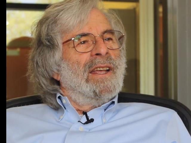 Leslie Lamport wearing glasses and smiling at the camera